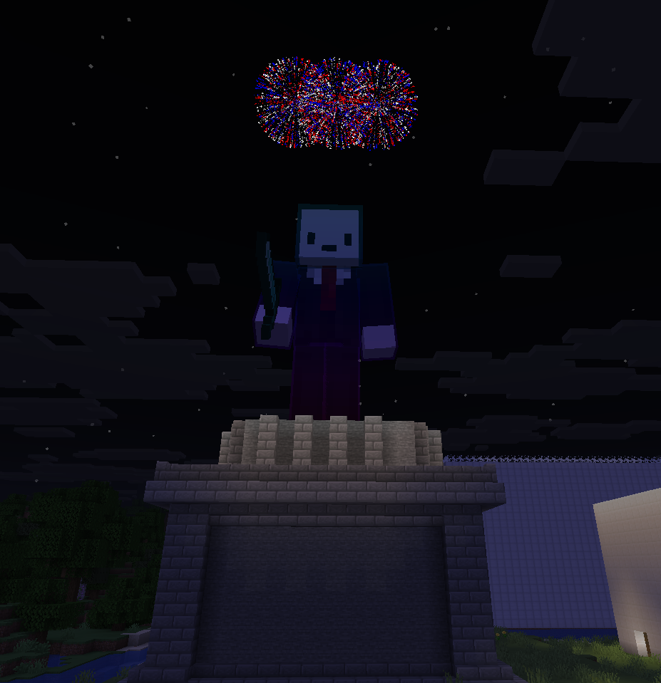 Founder statue lit up by fireworks at night