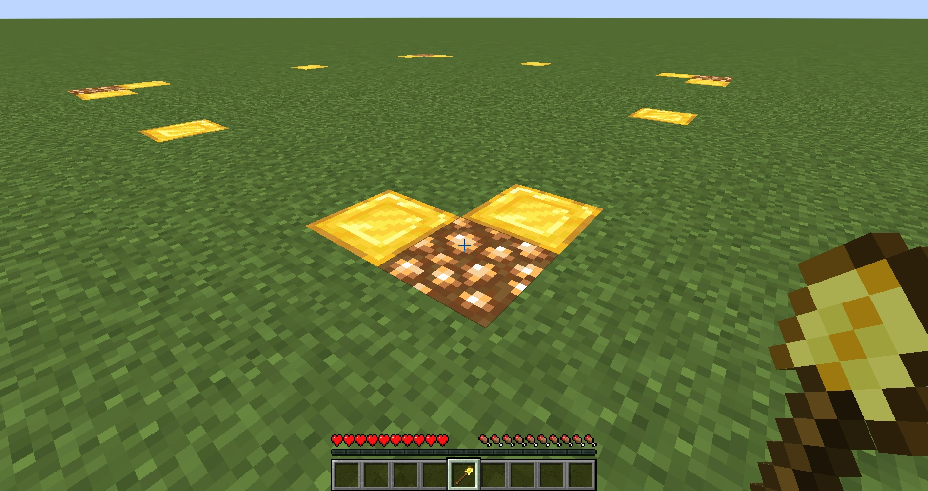 Using the gold shovel to claim two corners of land